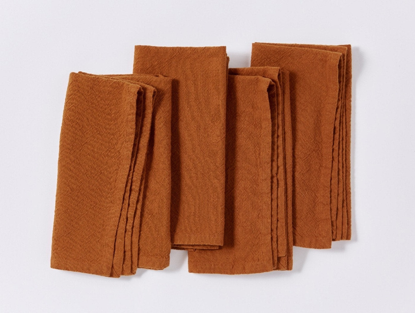 Set of burnt orange washed linen napkins